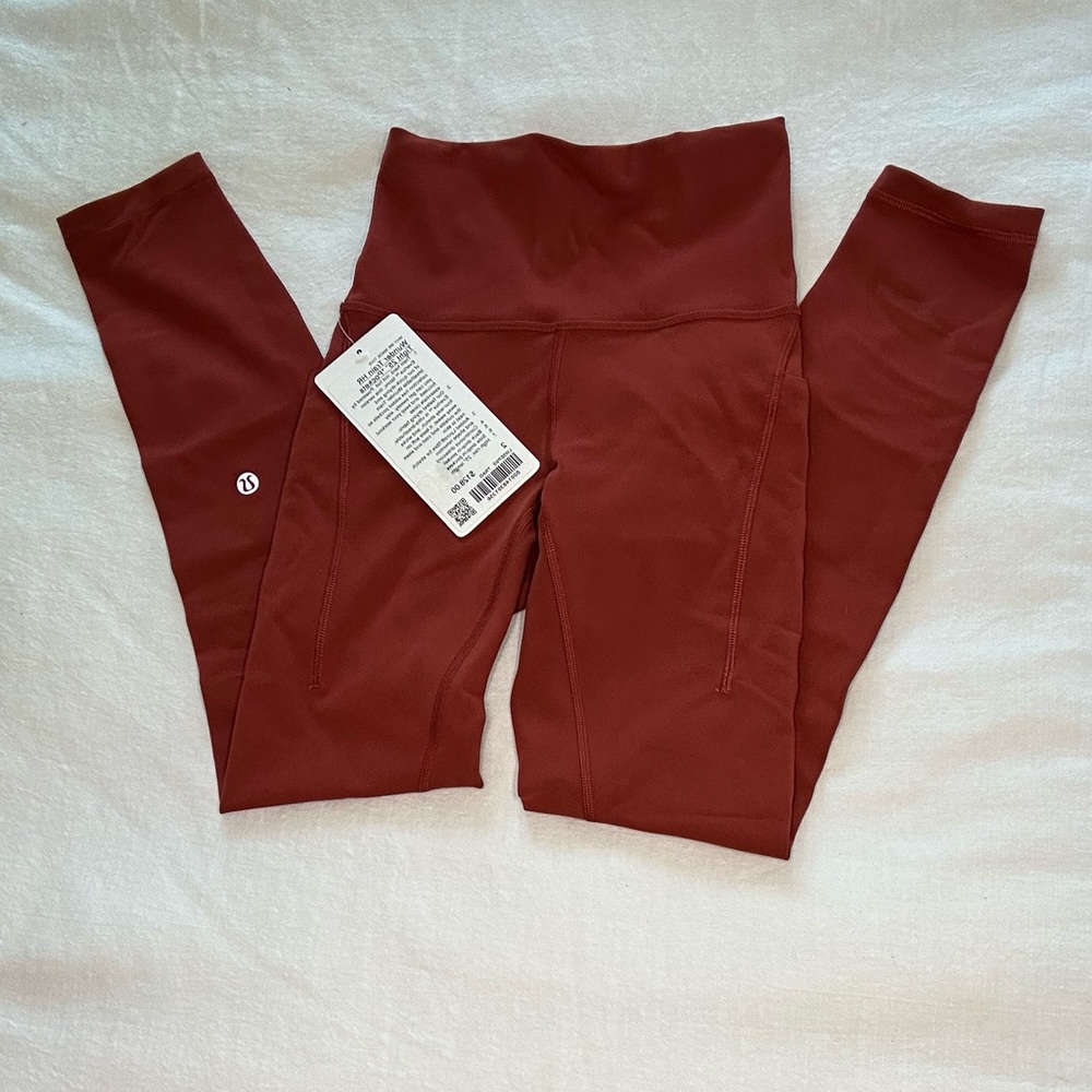 Lululemon wonder train HR tight 25” pockets.  Size 2.  Cayenne